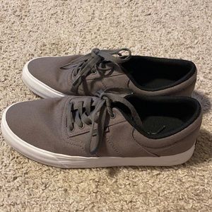 Grey low top Supra shoes